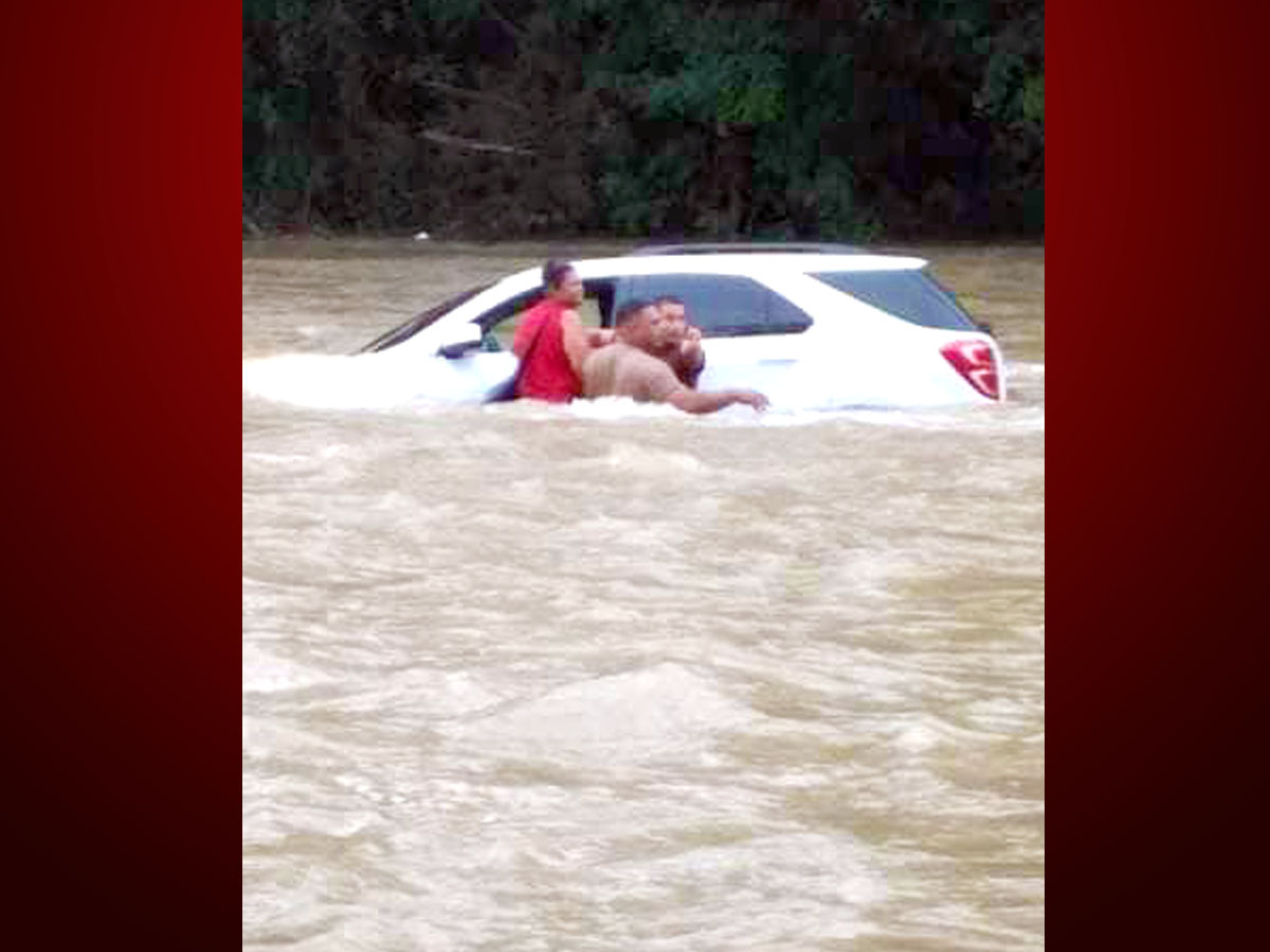 Cayo police officers honored for saving woman whose vehicle plunged into the Mopan River